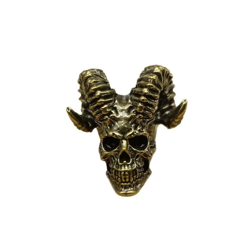 Liten dödskalle med horn i mässing